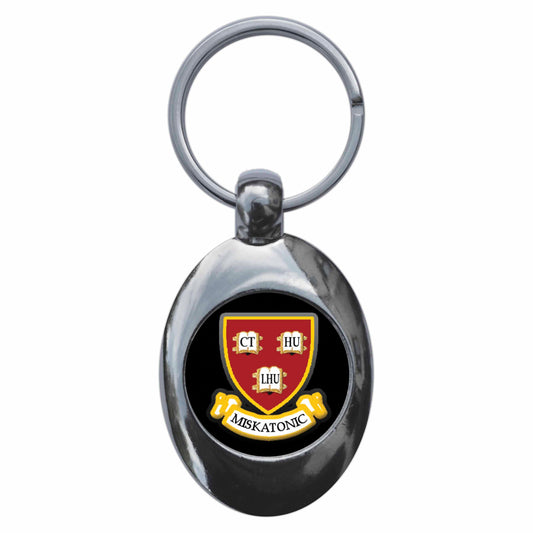 A picture of the front of the product, titled Miskatonic University Crest Metal Keyring With Trolley Coin