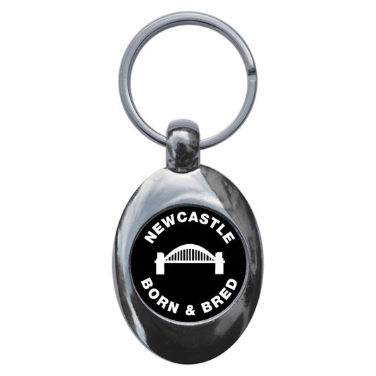 A picture of the front of the product, titled Newcastle Born & Bred Metal Keyring With Trolley Coin