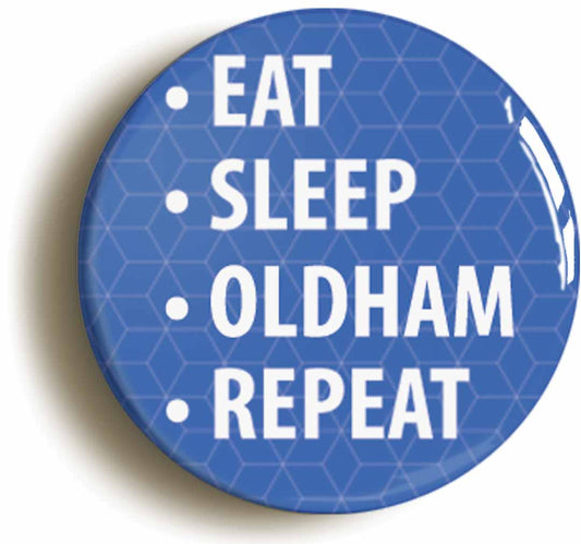 A picture of the front of the product, titled Eat Sleep Oldham Repeat Button Pin Badge