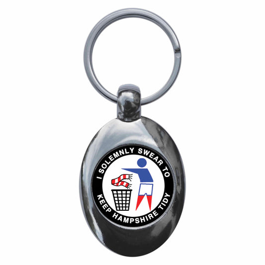 A picture of the front of the product, titled I Swear To Keep Hampshire Tidy Portsmouth Metal Keyring With Trolley Coin