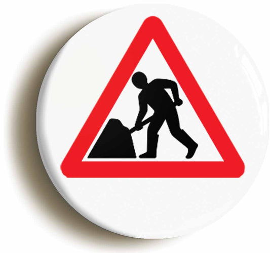A picture of the front of the product, titled Road Works Men At Work Funny Sign Button Pin Badge