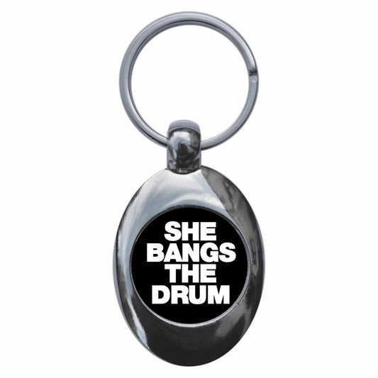 A picture of the front of the product, titled She Bangs The Drum Metal Keyring With Trolley Coin
