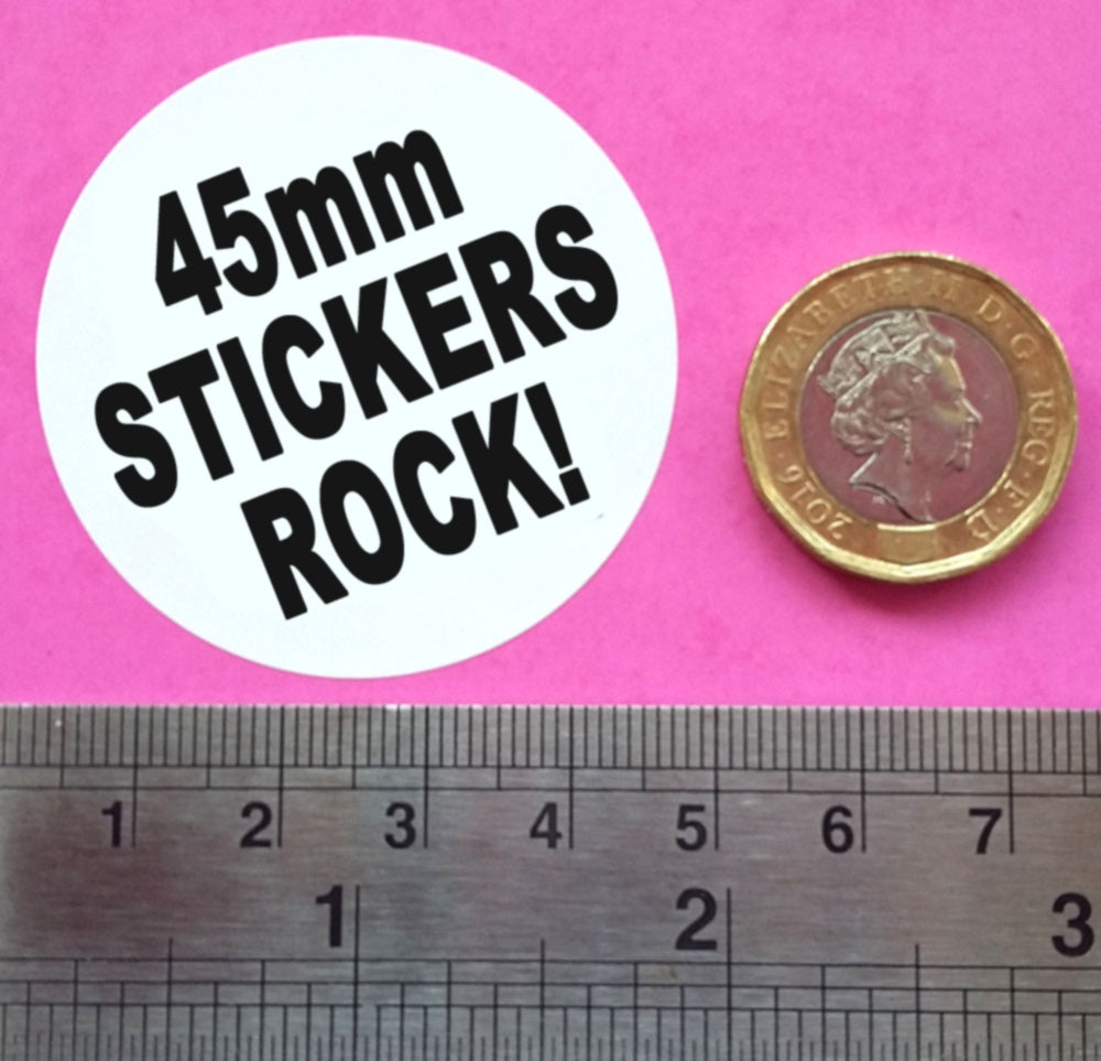 A picture of a single sticker with a coin for scale