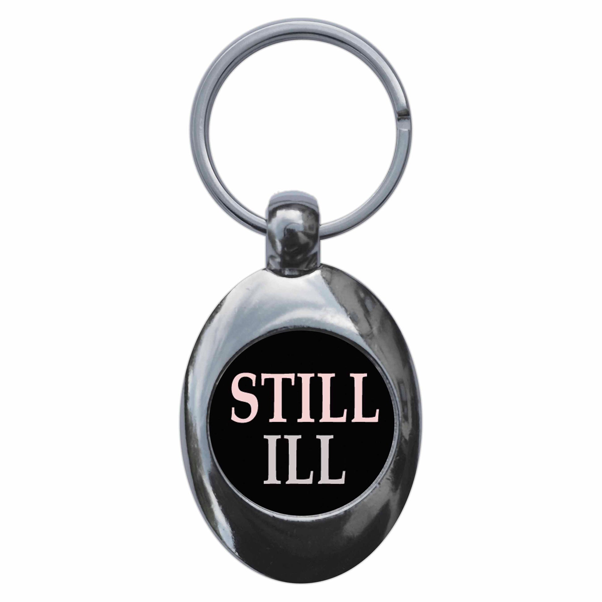 A picture of the front of the product, titled Still Ill Metal Keyring With Trolley Coin