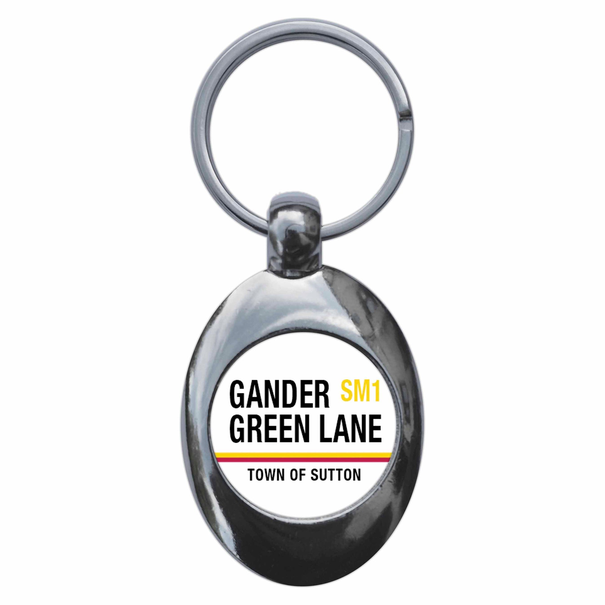 A picture of the front of the product, titled Gander Green Lane SM1 Sutton Road Sign Metal Keyring With Trolley Coin