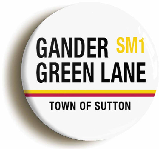 A picture of the front of the product, titled Gander Green Lane SM1 Sutton Road Sign Button Pin Badge