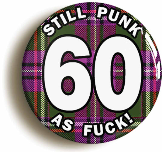 A picture of the front of the product, titled Still Punk As Fuck 60th Sixtieth Birthday Tartan Button Pin Badge