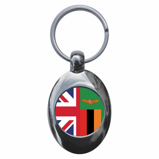 A picture of the front of the product, titled Zambia United Kingdom Split Flag Metal Keyring With Trolley Coin